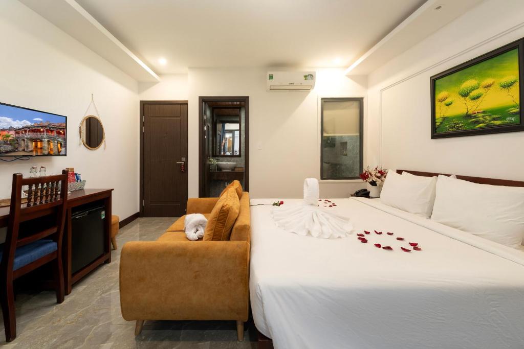 Giường trong phòng chung tại May Boutique Villa Hội An