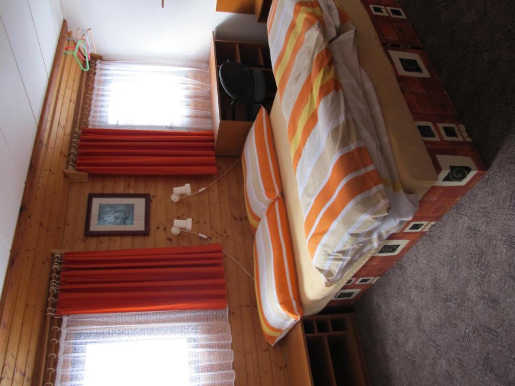 Postel nebo postele na pokoji v ubytování Guest House U Lakomce