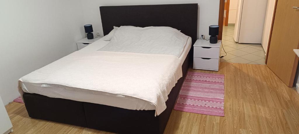 Postel nebo postele na pokoji v ubytování Apartments Carmen
