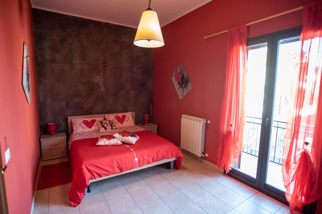 Postel nebo postele na pokoji v ubytování B&B LAVIKA PEDARA