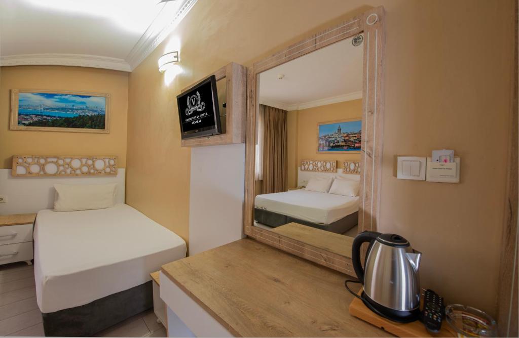 Postel nebo postele na pokoji v ubytování GRAND VATAN HOTEL