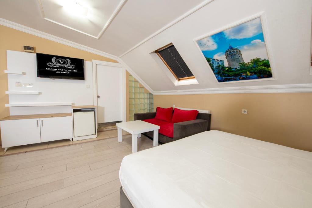 TV a/nebo společenská místnost v ubytování GRAND VATAN HOTEL