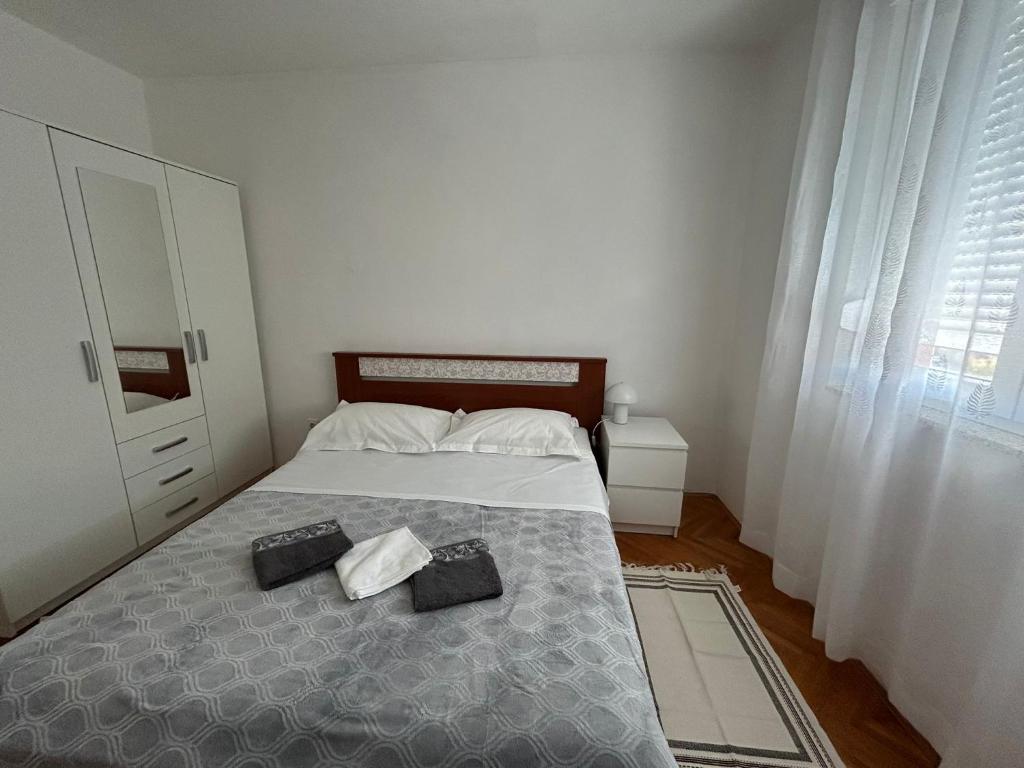 Postel nebo postele na pokoji v ubytování Apartman Mirna