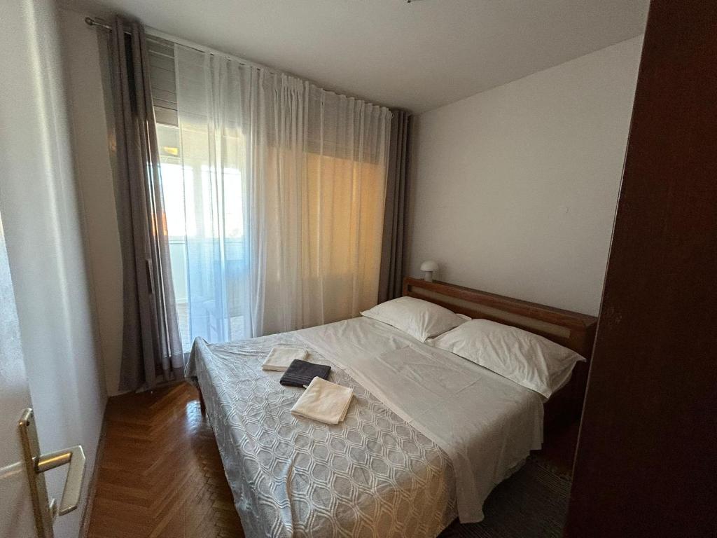 Postel nebo postele na pokoji v ubytování Apartman Mirna