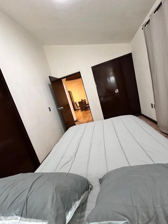 Postel nebo postele na pokoji v ubytování Central Petit Apartment