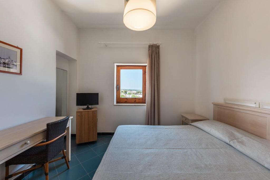 Postel nebo postele na pokoji v ubytování Hotel Lido Torre Egnazia