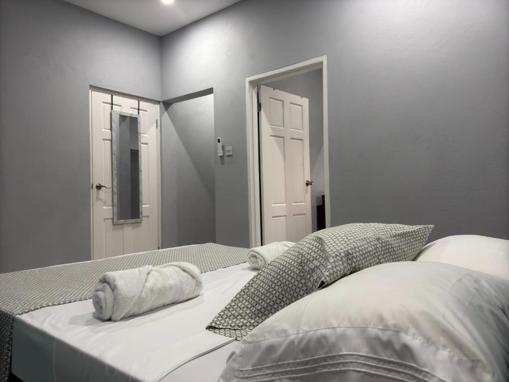 a bedroom with a bed with two pillows on it at Hilltop Condos Unit #2 in Gros Islet
