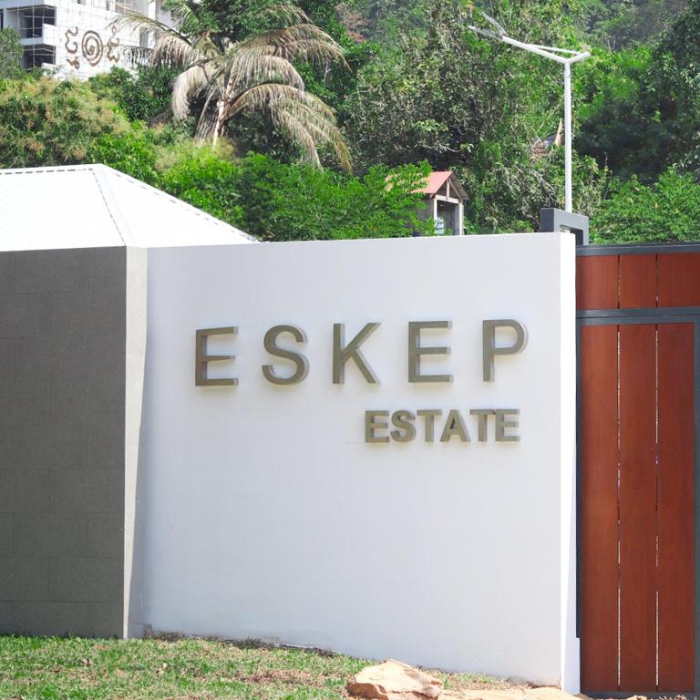 a sign that says eskipop estate behind a fence at Eskep Estate - Private Villas in Phumĭ Ŏng Char