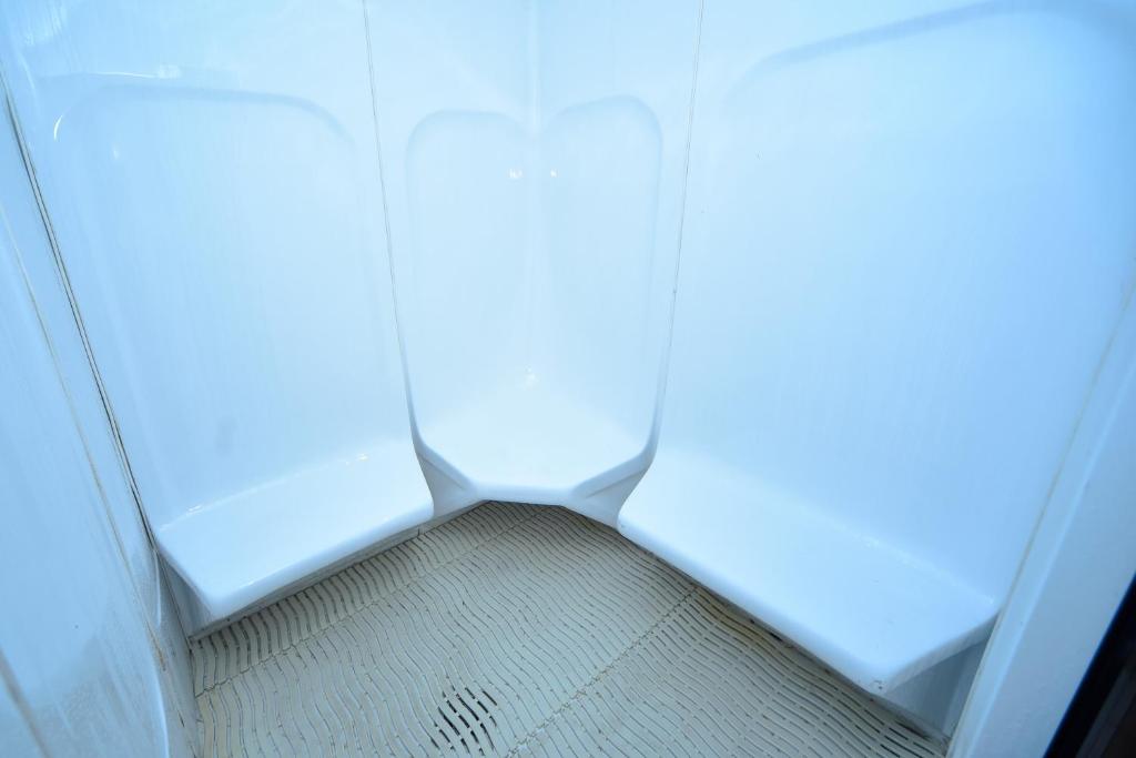 a room with a hallway with a floor and a window at Emirates Stars Hotel Apartments Dubai in Dubai