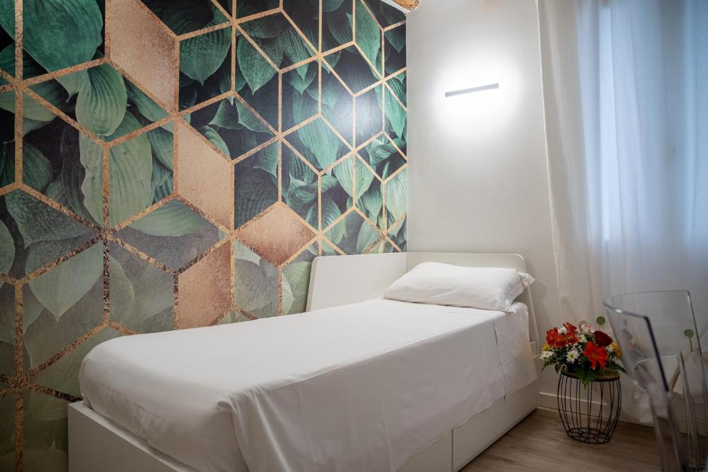 Postel nebo postele na pokoji v ubytování Hermes Venice
