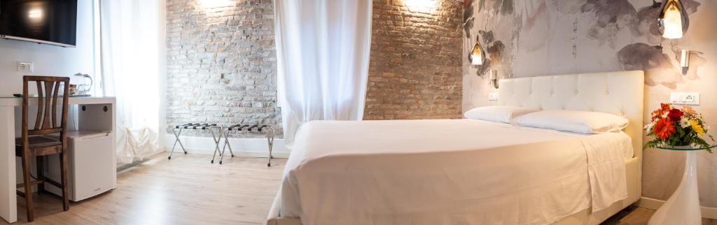Postel nebo postele na pokoji v ubytování Hermes Venice