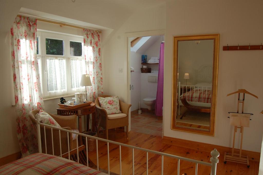 Postel nebo postele na pokoji v ubytování Beaufort Lodge B&B & Cottage