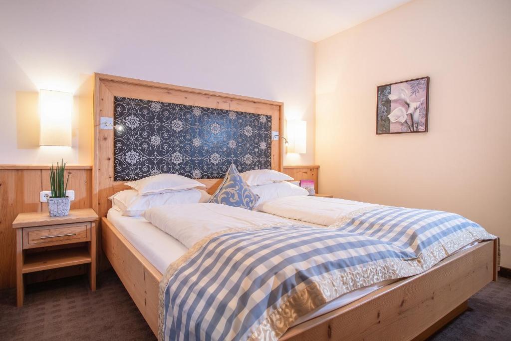 Postel nebo postele na pokoji v ubytování Alphaus Aparthotel