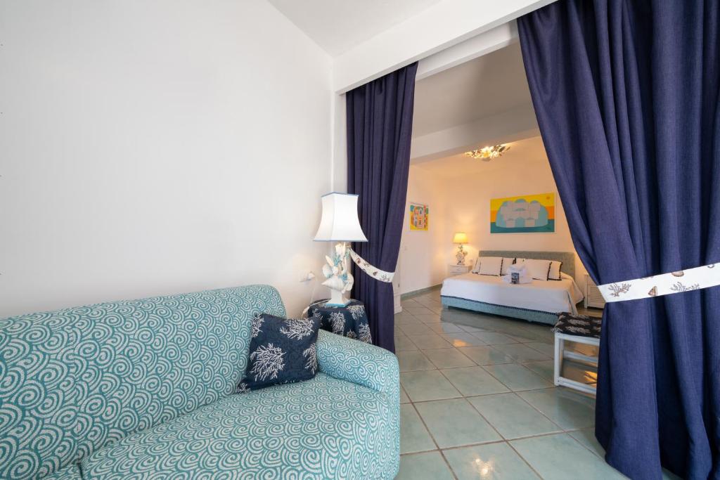 Ένα ή περισσότερα κρεβάτια σε δωμάτιο στο Relais Bijoux Ischia