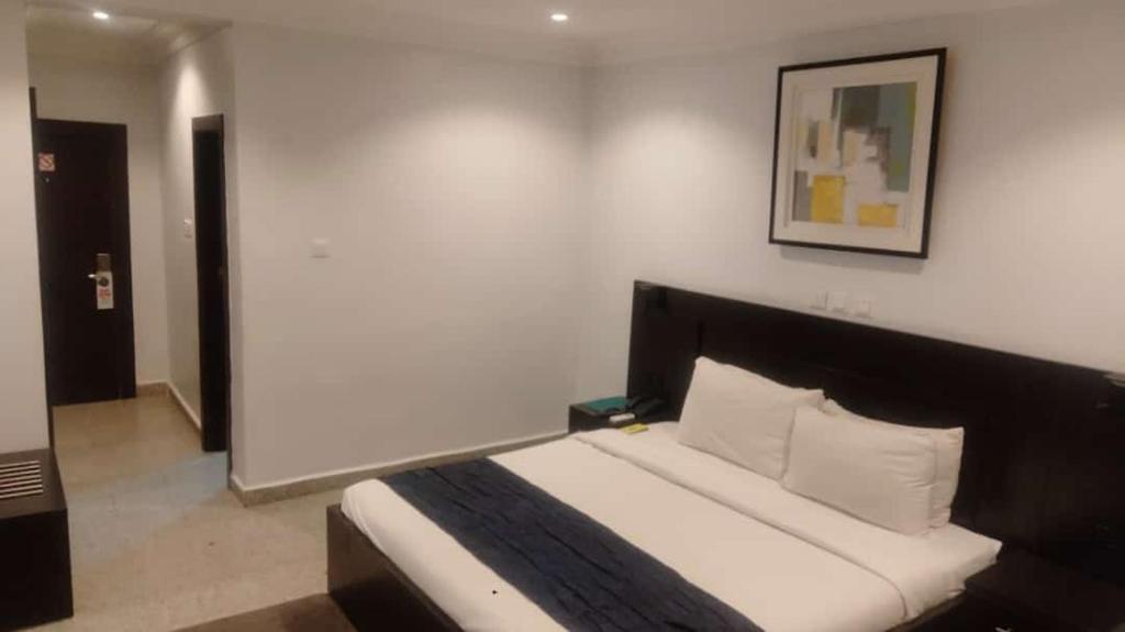 Postel nebo postele na pokoji v ubytování Jades Hotel