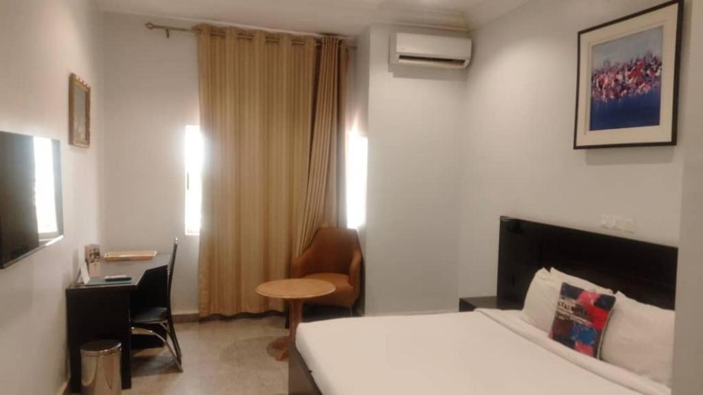 Postel nebo postele na pokoji v ubytování Jades Hotel