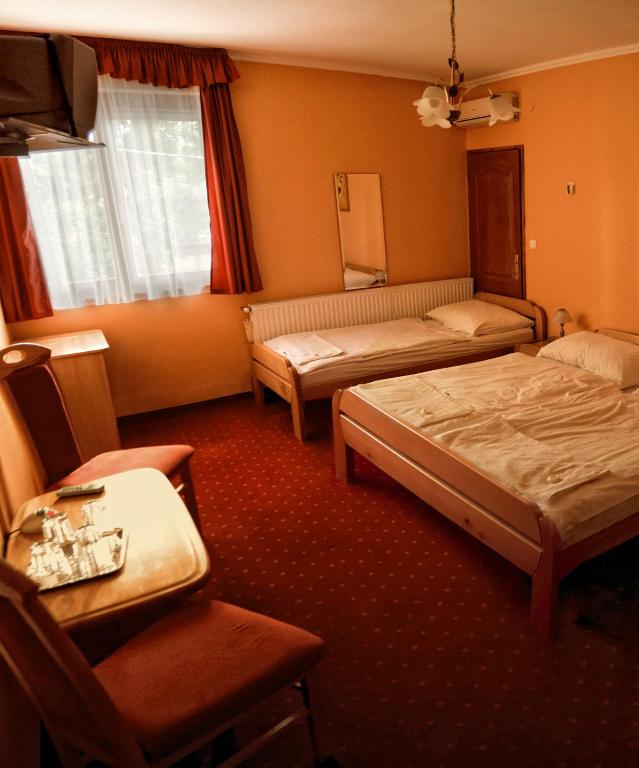 Postel nebo postele na pokoji v ubytování Euro Panzio