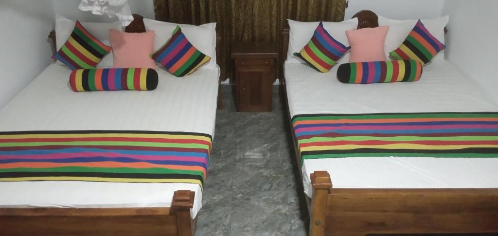Postel nebo postele na pokoji v ubytování Iduwara Guest