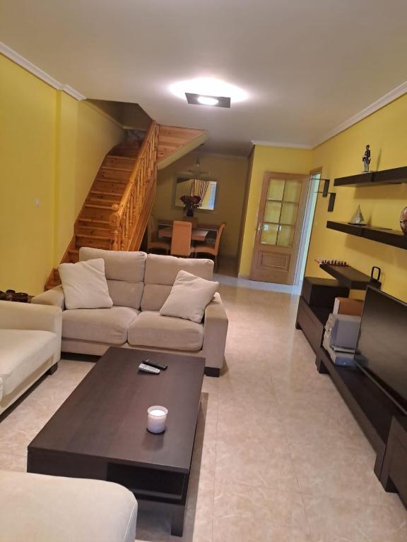 a living room with a couch and a table at Arca de Noé in Valle de Oro