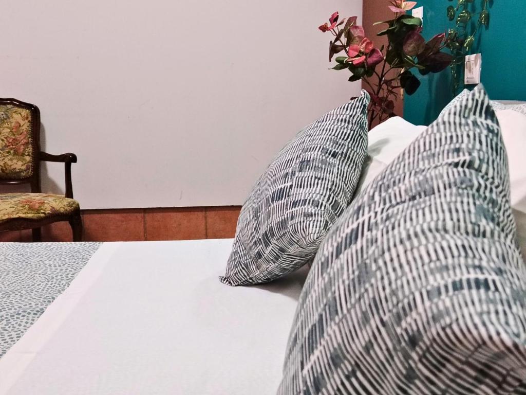 Postel nebo postele na pokoji v ubytování Pavarotti