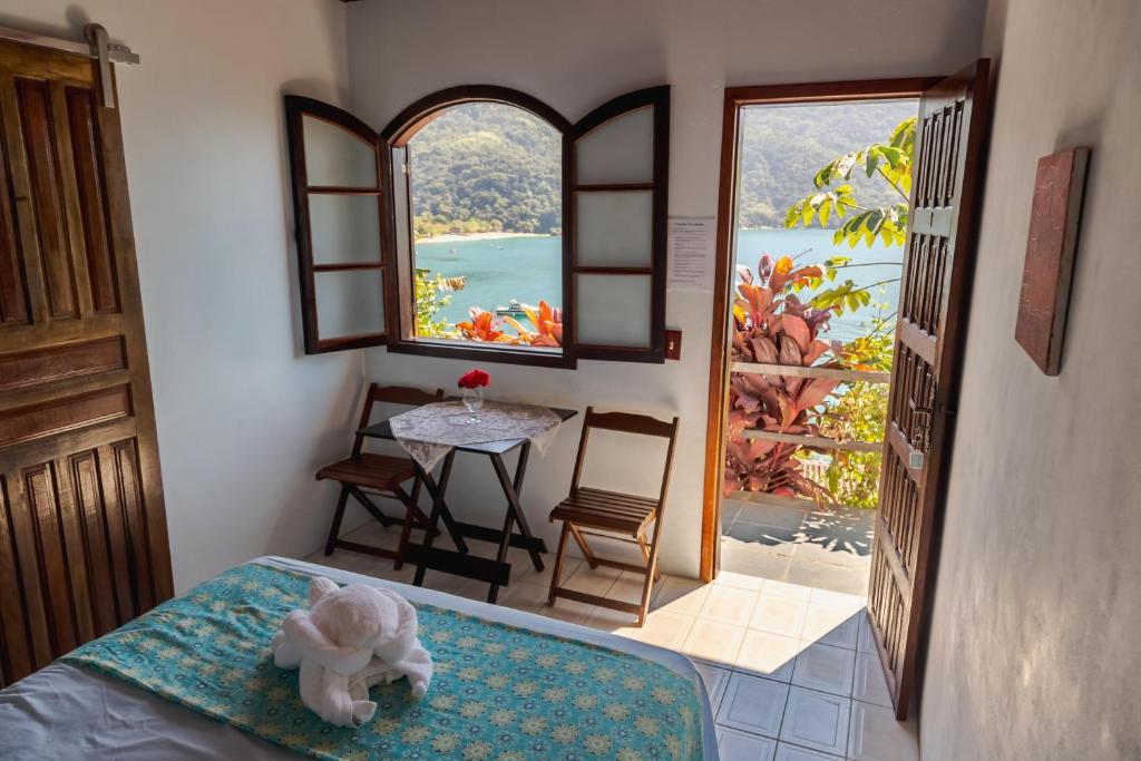 Cama ou camas em um quarto em Pousada Toca do Mar