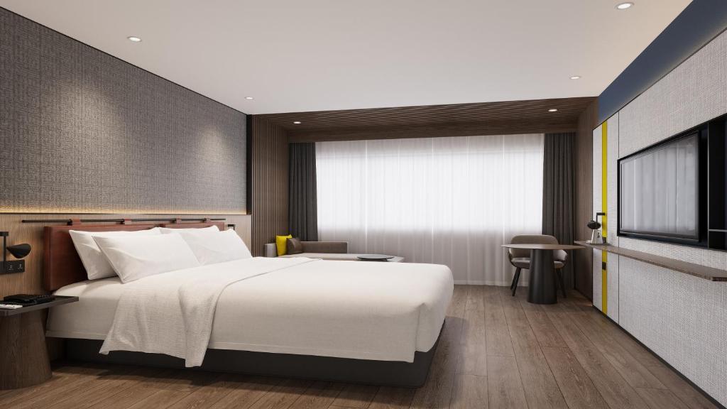 Postel nebo postele na pokoji v ubytování Holiday Inn Express Shenzhen Futian Center by IHG