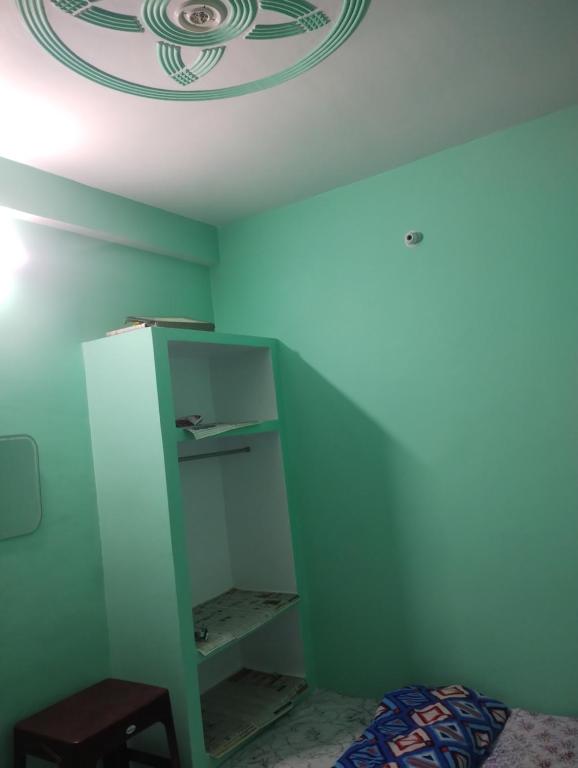 Postel nebo postele na pokoji v ubytování Shree Ram Homestay