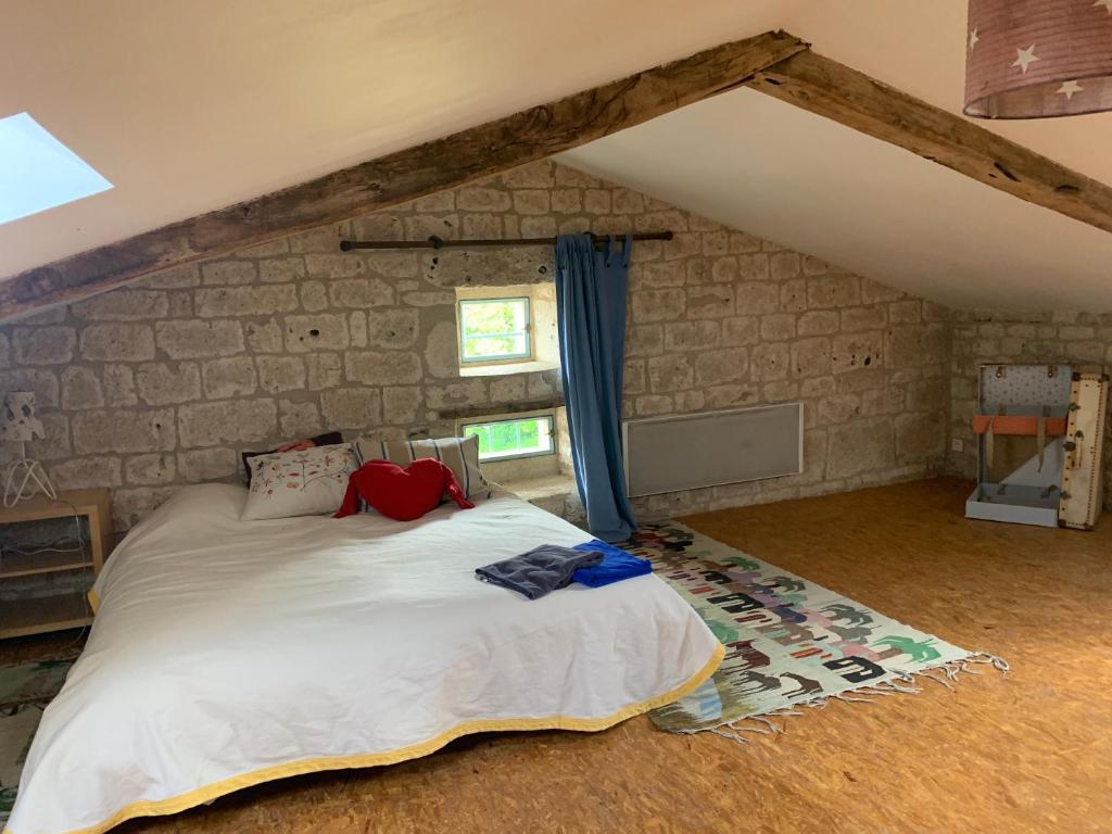 Voodi või voodid majutusasutuse Gîte de charme champêtre toas