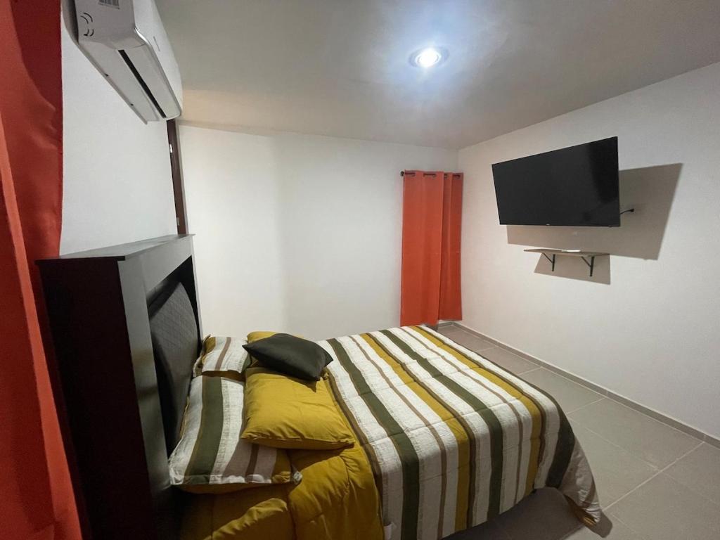 TV a/nebo společenská místnost v ubytování Itzamná House