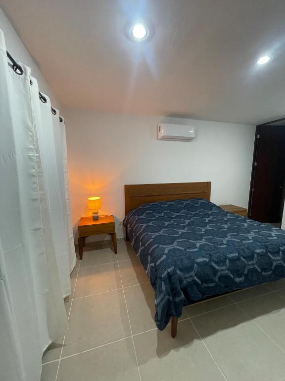 Postel nebo postele na pokoji v ubytování Itzamná House