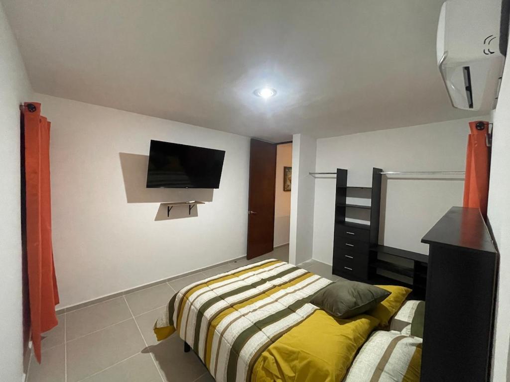 Postel nebo postele na pokoji v ubytování Itzamná House