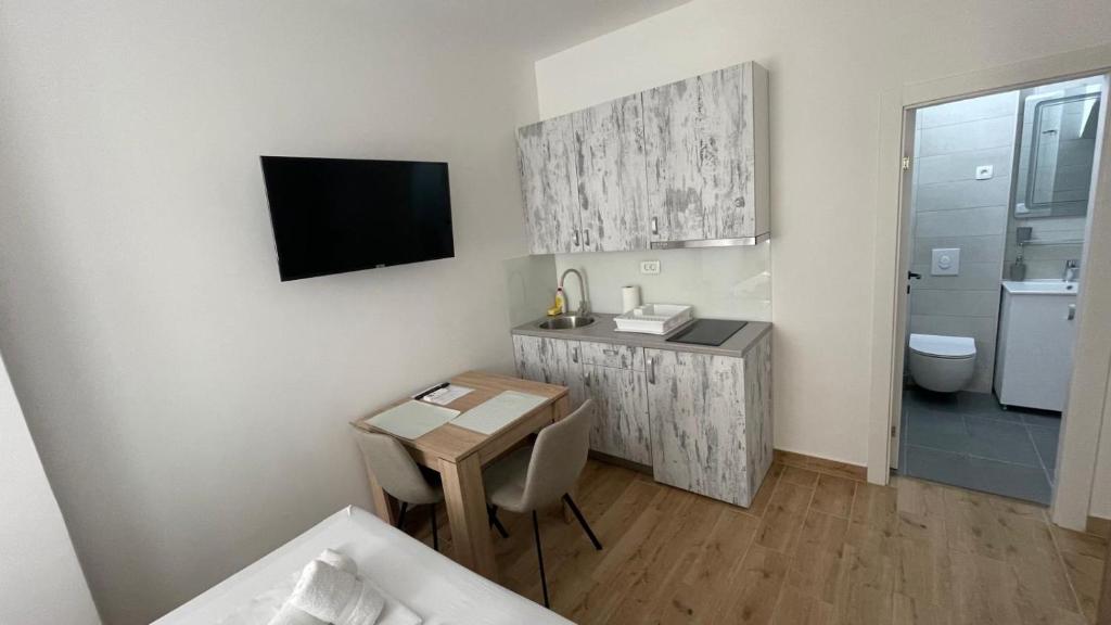 Kuchyň nebo kuchyňský kout v ubytování Palloma Studios