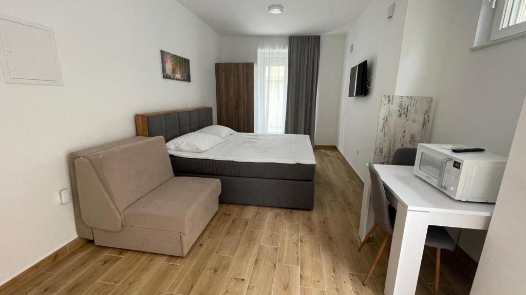 Postel nebo postele na pokoji v ubytování Palloma Studios