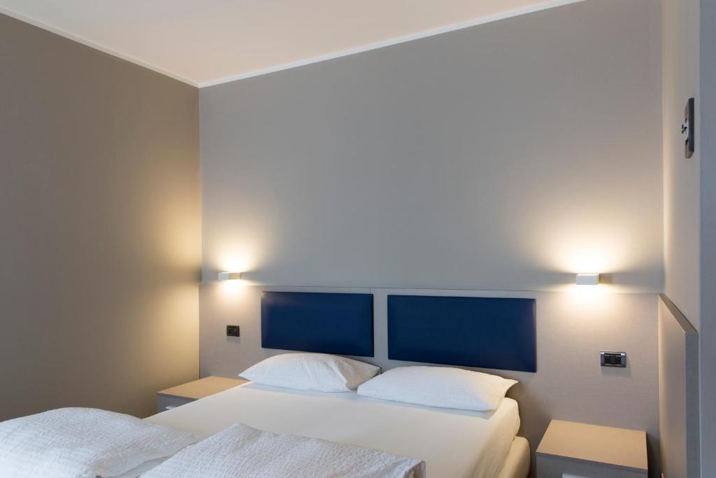 Postel nebo postele na pokoji v ubytování Albergo Montenegro
