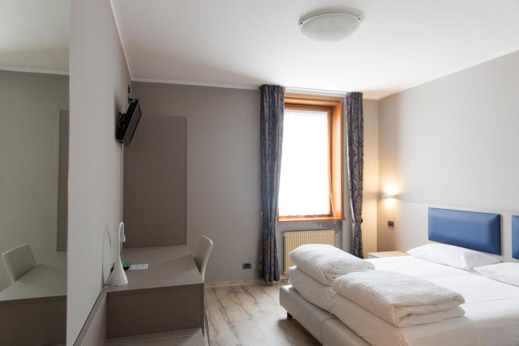 Postel nebo postele na pokoji v ubytování Albergo Montenegro