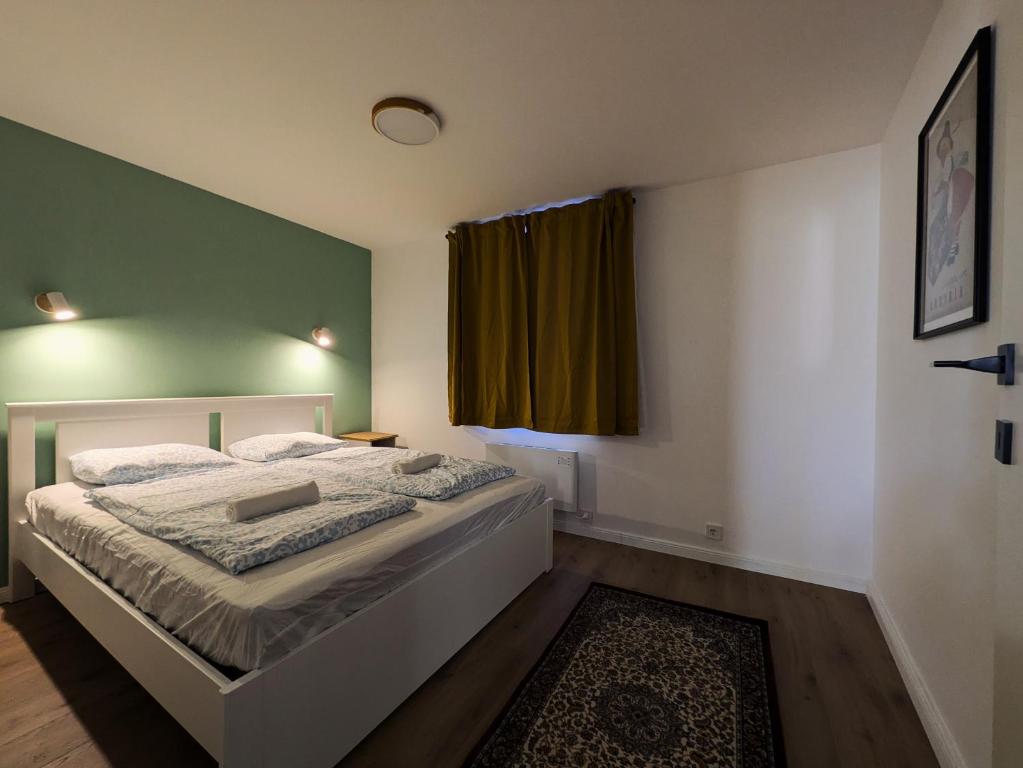 Postel nebo postele na pokoji v ubytování mg4 Apartments