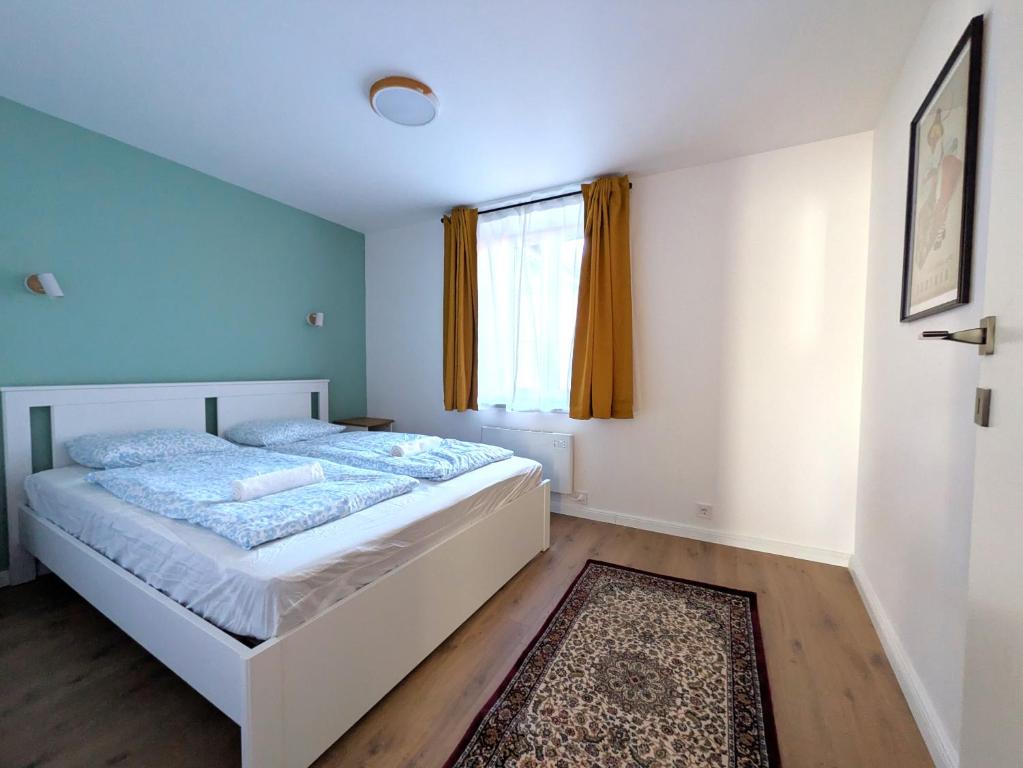 Postel nebo postele na pokoji v ubytování mg4 Apartments