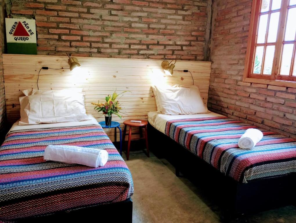 Postel nebo postele na pokoji v ubytování Camping Carcará da Canastra