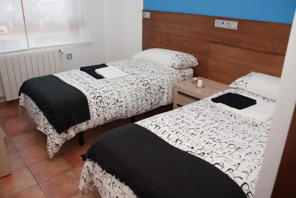 Posteľ alebo postele v izbe v ubytovaní Hotel Cuéntame