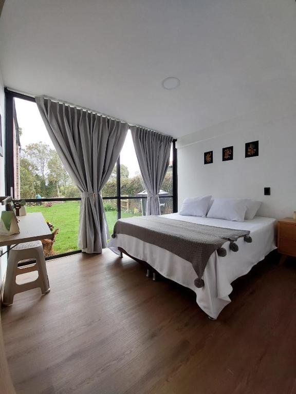 Postel nebo postele na pokoji v ubytování Nordika House - ideal para fotografía y descanso