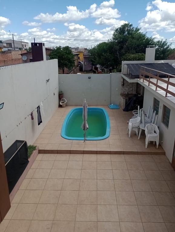 a swimming pool on the roof of a house at Host Family S in São Gabriel