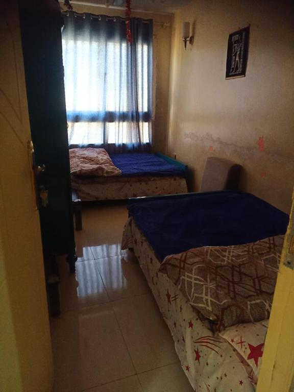 Postel nebo postele na pokoji v ubytování Sun Hostel
