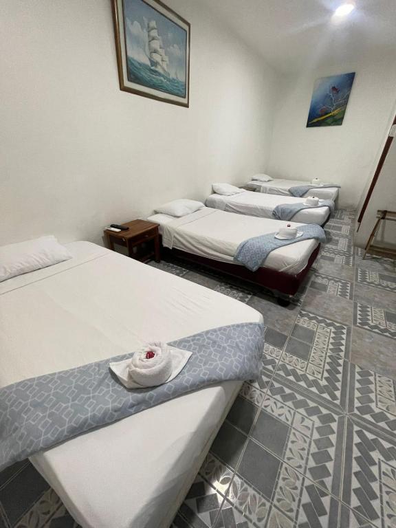 Postel nebo postele na pokoji v ubytování Hostal Gardner
