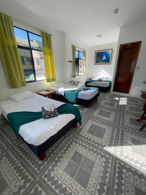 Postel nebo postele na pokoji v ubytování Hostal Gardner