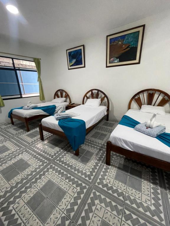 Postel nebo postele na pokoji v ubytování Hostal Gardner