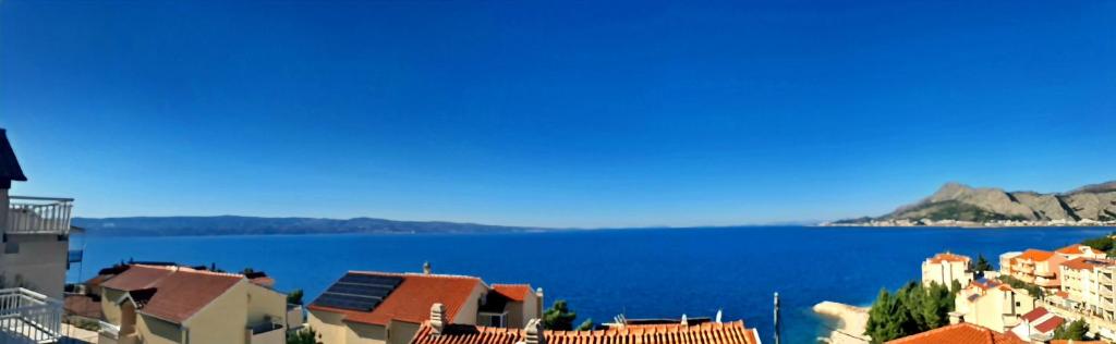 a view of a city and a body of water at Villa Del Mar Omiš in Omiš