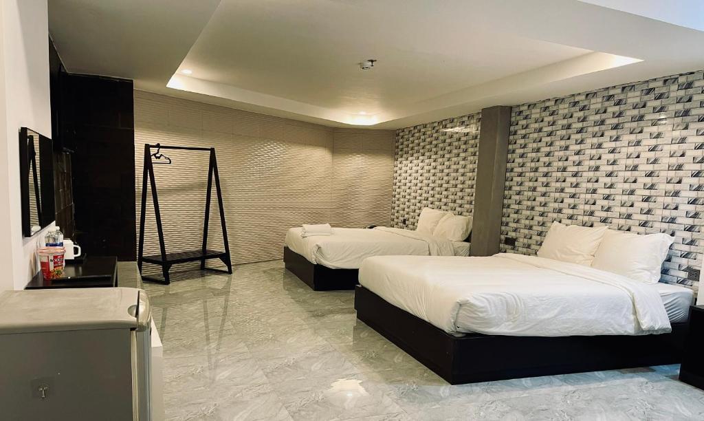 Postel nebo postele na pokoji v ubytování Ben Ben Hotel