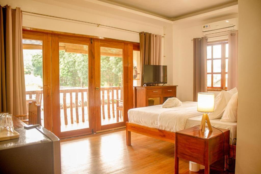 Postel nebo postele na pokoji v ubytování Wilcon Guesthouse Catulayan