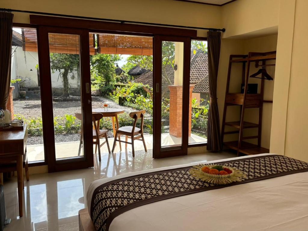 Postel nebo postele na pokoji v ubytování Ubud Sky