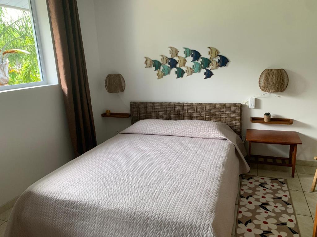Postel nebo postele na pokoji v ubytování Tiki Ora Lodge - Manu